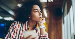 Young woman thoughtfully considering her pregnancy options after an unexpected pregnancy, reflecting on whether abortion is her only choice.