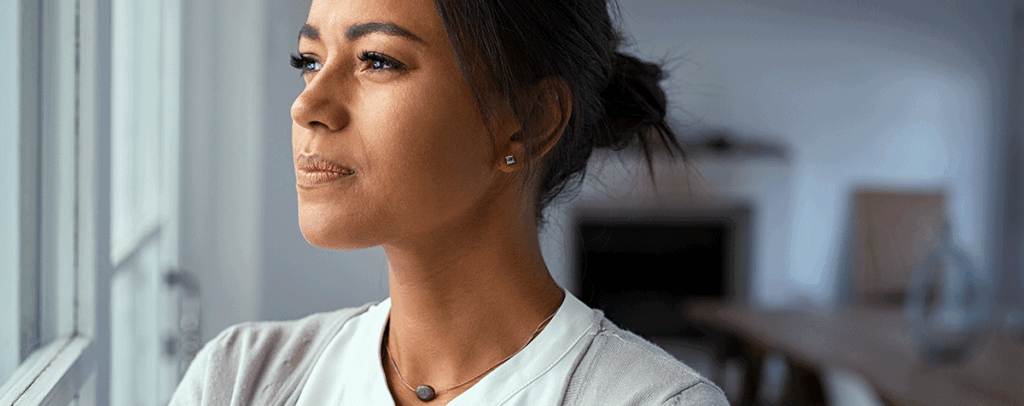 Thoughtful woman considering the potential risks of the abortion pill.